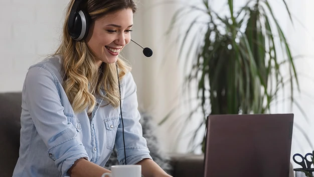 Portrait of a young beautiful woman working from home as an online support