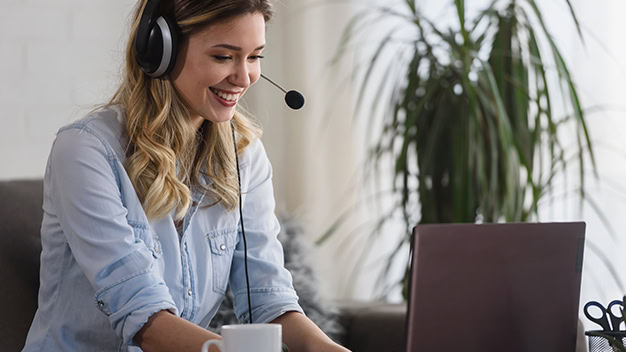 Portrait of a young beautiful woman working from home as an online support